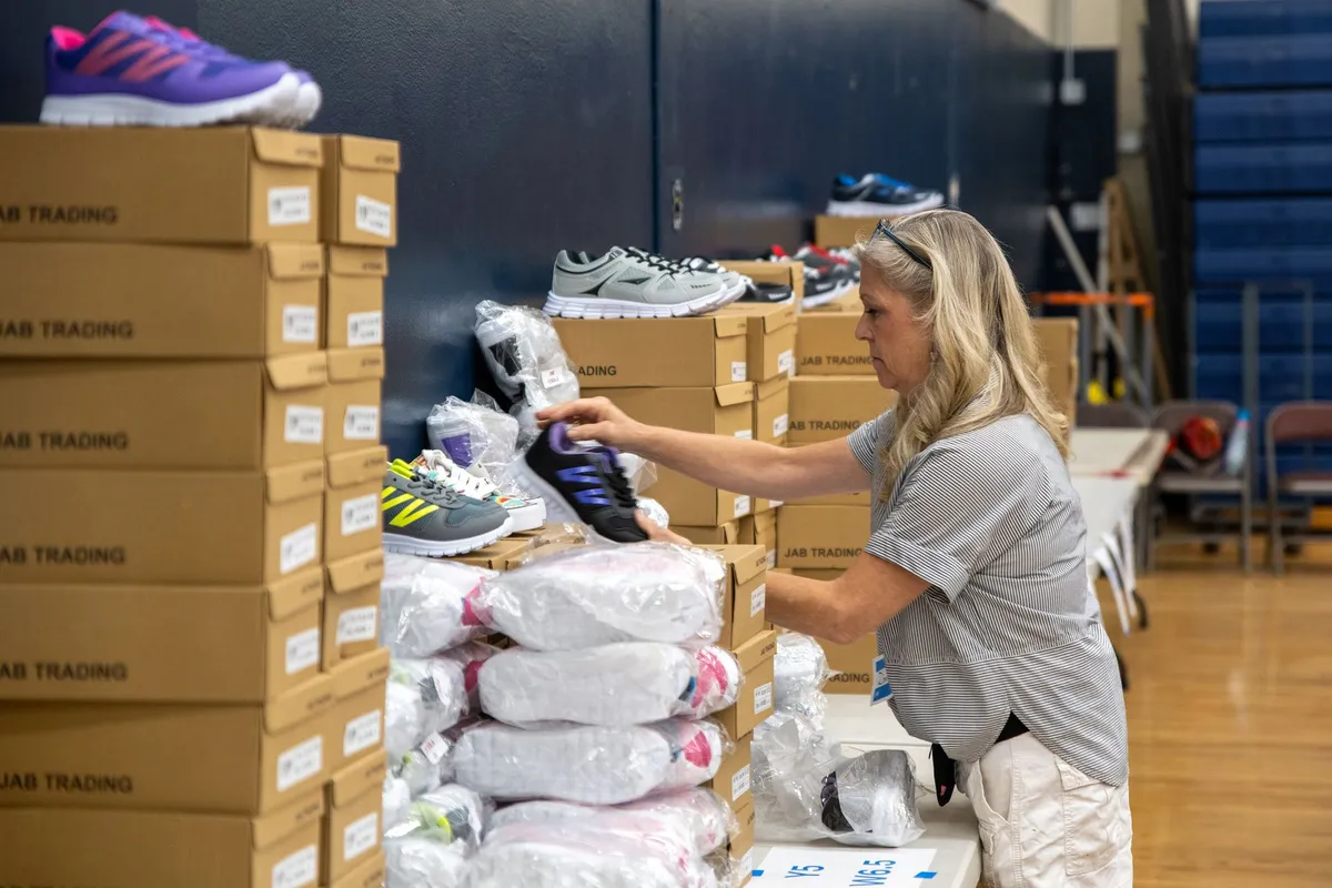 Shoes being organized beside stacks of shoe boxes at a Hope for Nevada County event.